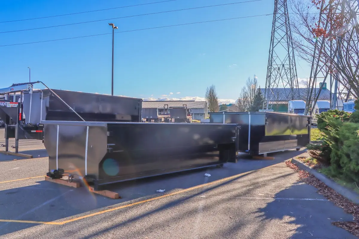 Roll-off dumpster ready for waste disposal at job site for 3 Yard Dumpster Rental in Sugar Hill